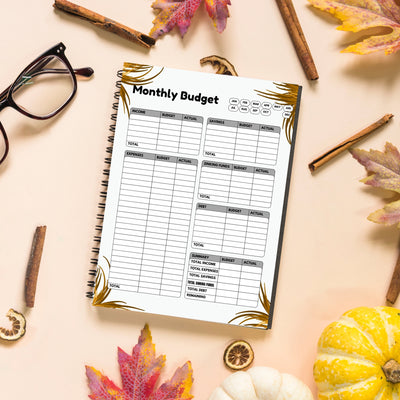 Sharpbryte digital monthly budget planner printable on spiral notebook with fall decor and glasses